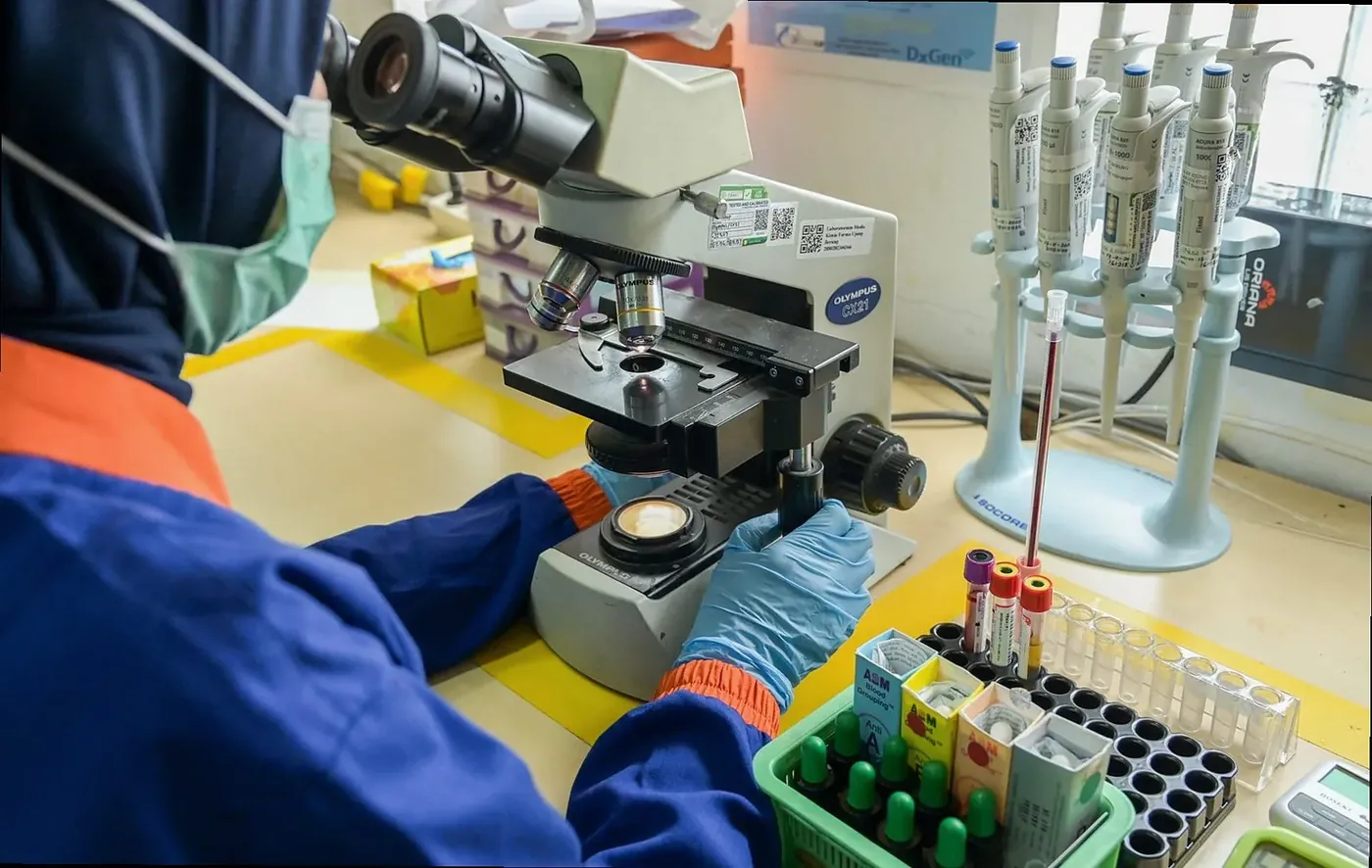 Laboratory bench with pipettes and sample racks